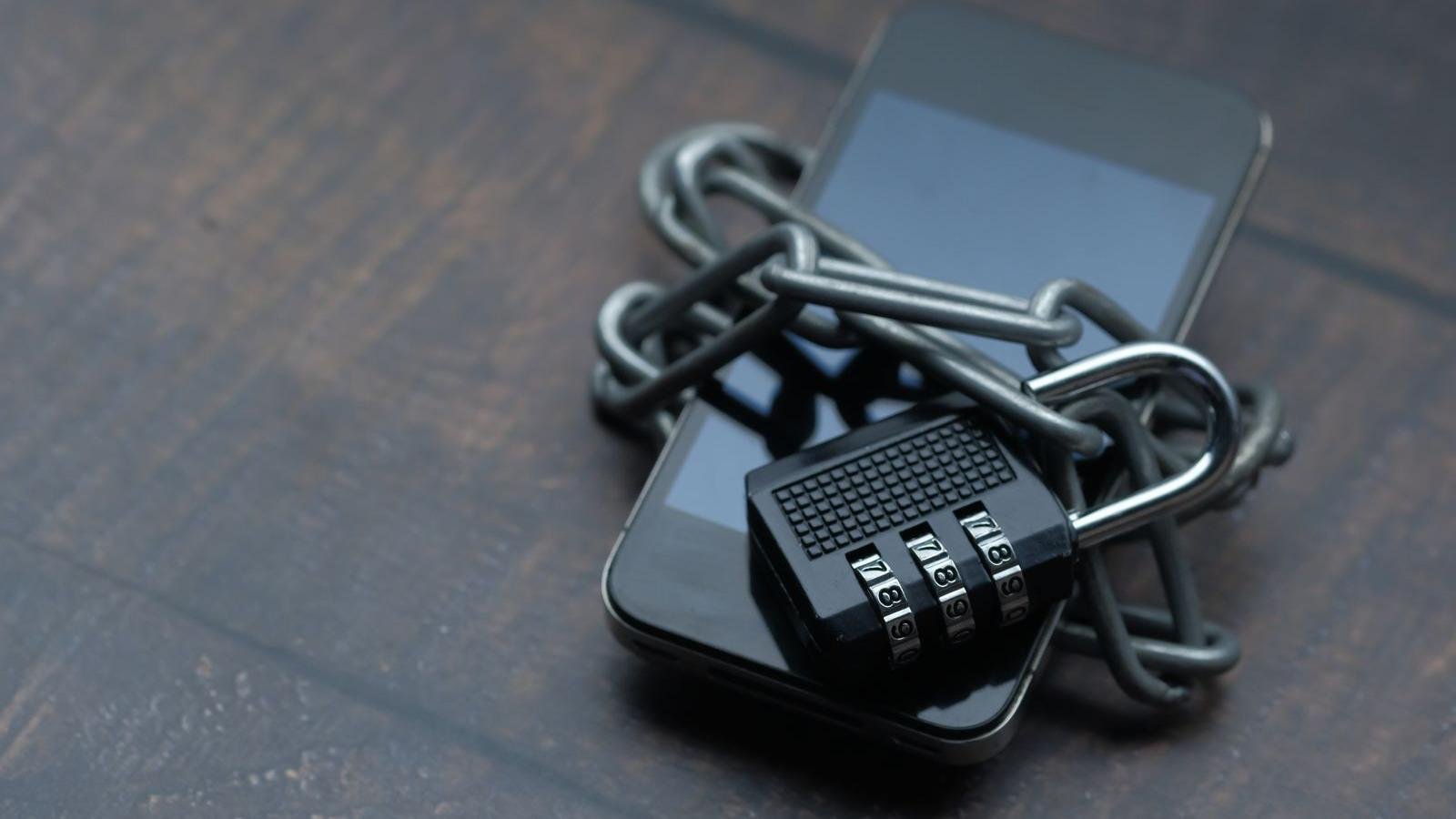 Smartphone locked with a chain and padlock